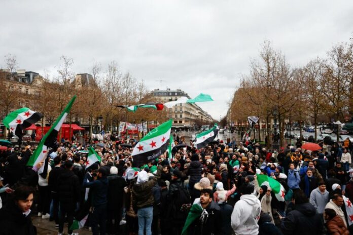 Celebrations in Paris after Syrian rebels capture Damascus and overthrow al-Assad