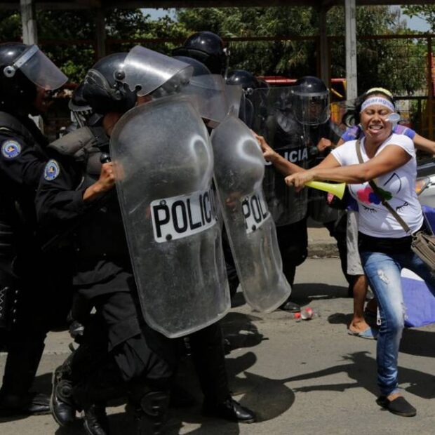 79009080_TOPSHOTWomen-clash-with-riot-police-blocking-a-street-during-a-protest-against-Nicaragua-620x620.jpg