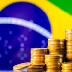 A,Stack,Of,Gold,Coins,On,The,Background,Of,The