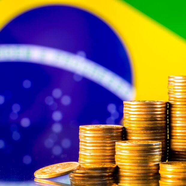 A,Stack,Of,Gold,Coins,On,The,Background,Of,The